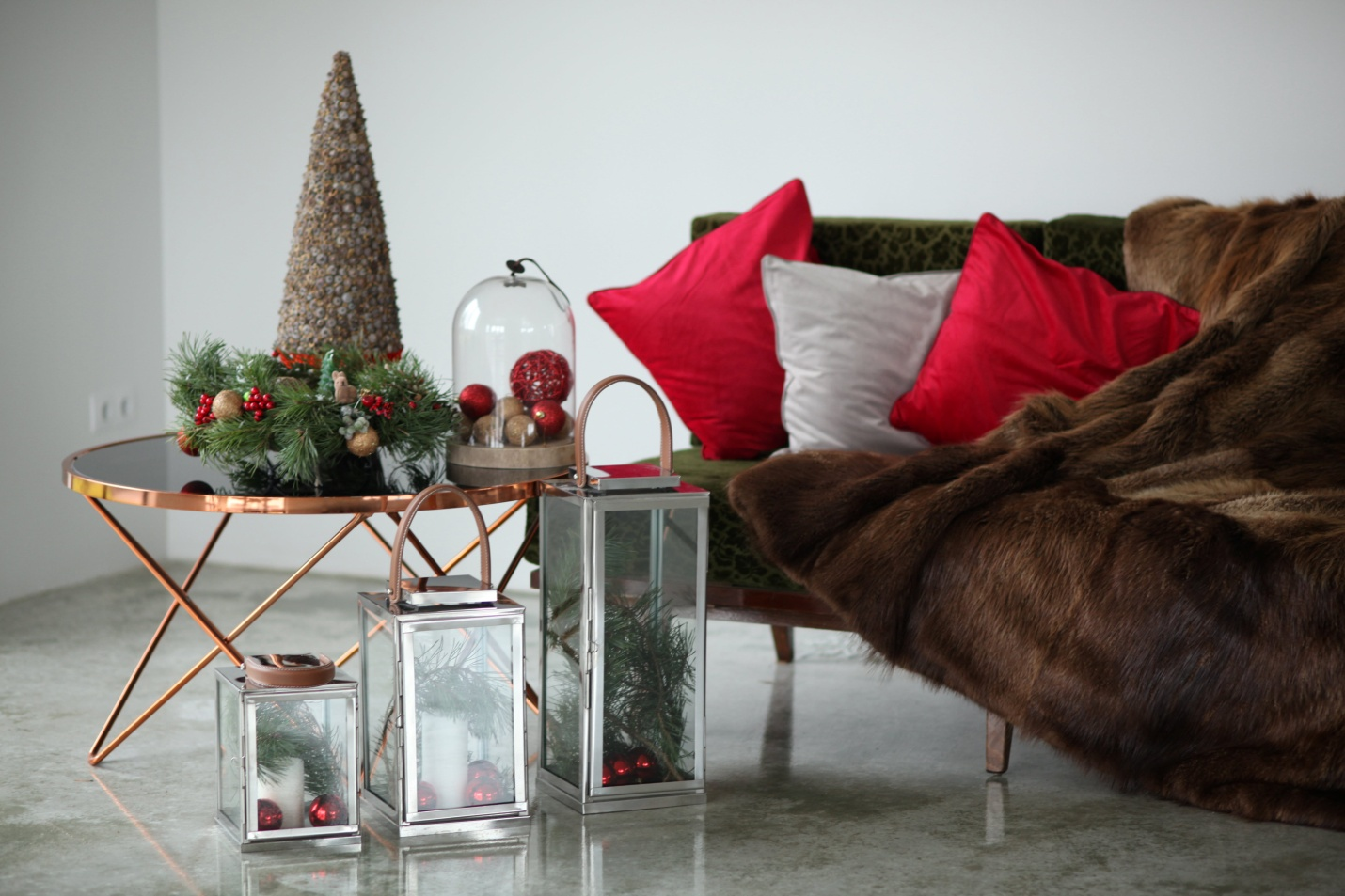 A sofa and Christmas accents and accessories