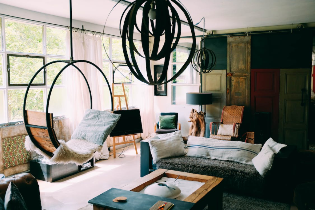 A living room with textures and indoor swing