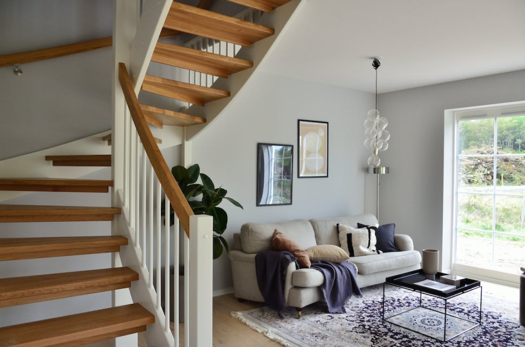 Wooden staircase toward a living room