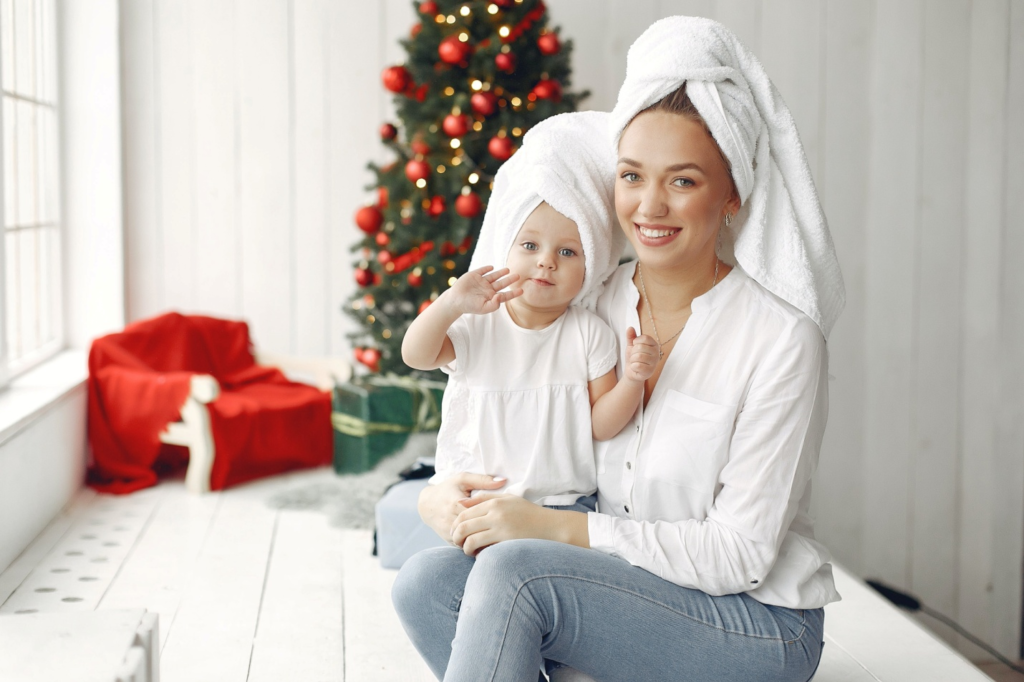 A mother and daughter wearing towels on their heads