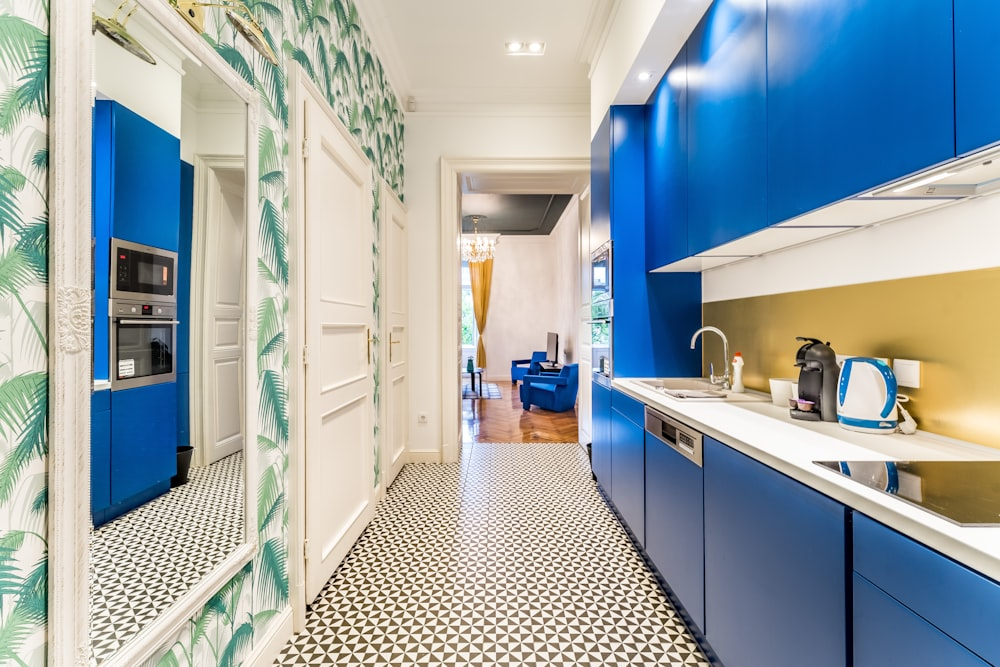 A kitchen with blue cabinets